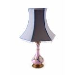 Late 19th century table lamp with tulip shaped lampshade. The base of the lamp is painted with