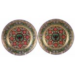 Pair of porcelain plates, elaborately decorated borders surrounding the crest of Nicholas I,