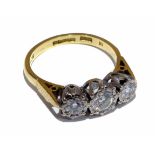 18ct yellow gold three stone diamond ring, round brilliant cut diamonds in white rub-over illusion