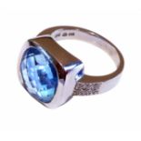 14ct white gold topaz and and diamond ring, cushion cut blue topaz in square bezel setting,