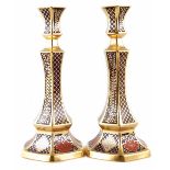 Pair of Caverswall candlesticks, decorated with Romany pattern in a Crown Derby Imari style, printed