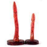Two 19th century Japanese pink coral figures Kannon, 11cm and 8cm (inc. hardwood bases).