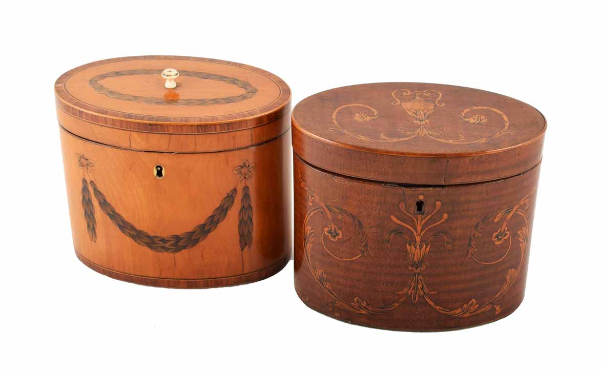 Two early 19th century oval section tea-caddies. One veenered in beech wood, the other in