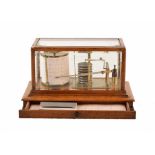 Edwardian oak case barograph. With brass fittings and inkwell stand. Drawer contains barograph