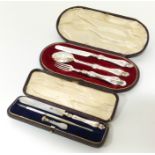 Three piece silver christening set and a boxed writing set. We are unable to provide condition