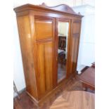 Victorian mahogany triple wardrobe with central mirror door, 187cm wide. Unfortunately we cannot