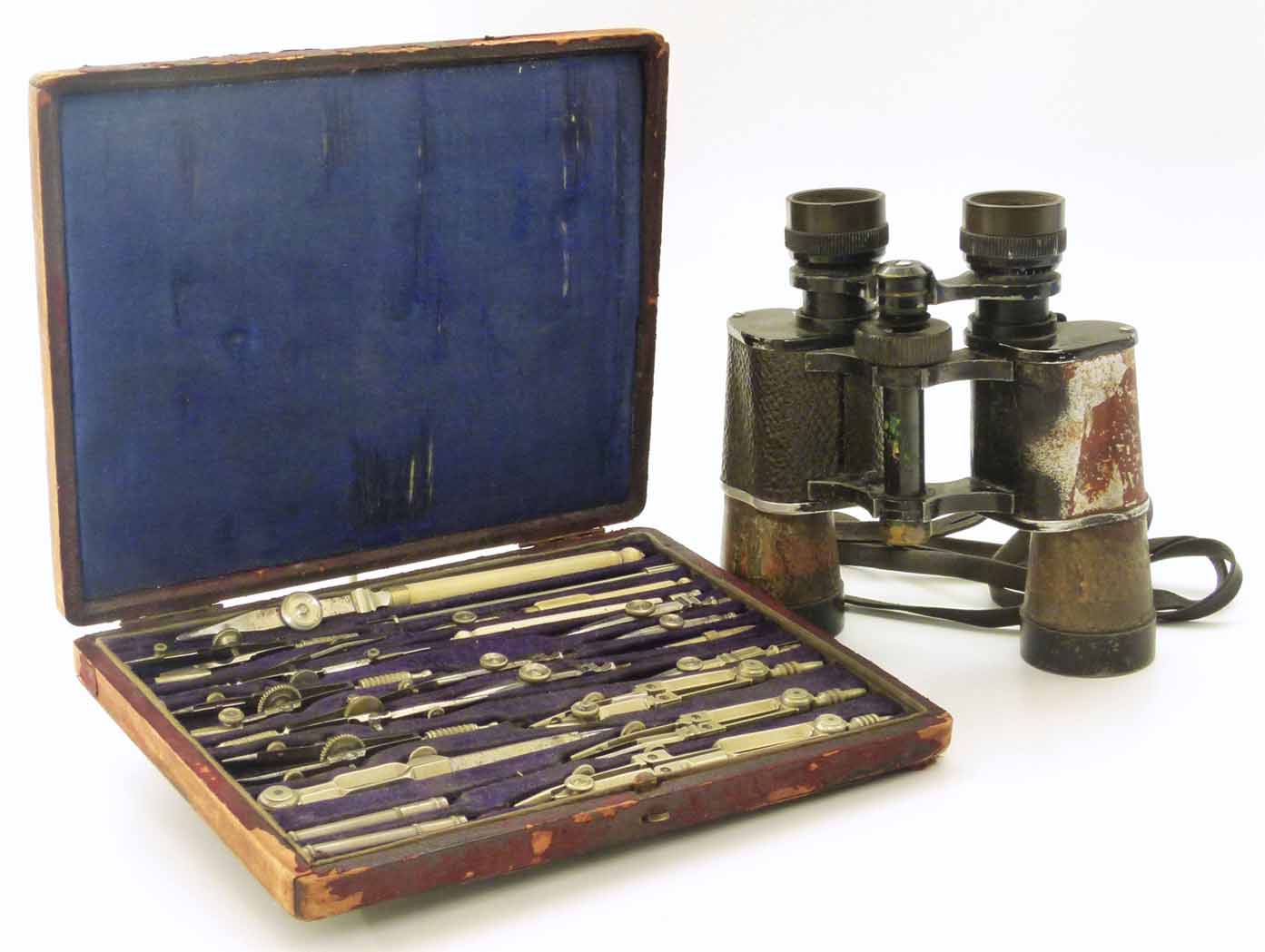 Cased set drawing instruments and paid Karl Muller binoculars (Mercury 12 x 35). Unfortunately we