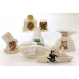 Seven pieces of crested ware, Carlton zeppelin finder, Felix the cat, Dorking Tank model and Carlton