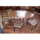 Harlequin set of six Lancashire spindle back chairs with rush seats and oak drop-leaf dining