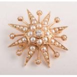 A diamond and cultured pearl star brooch, central round brilliant cut diamond approx. 0.25ct,