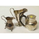 To silver jugs together with another lidded silver jug. approx weight 378.6g Unfortunately we are
