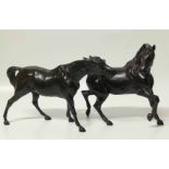 A pair of cast black painted horses Unfortunately we are not doing condition reports on this sale.