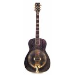 Ozark resonator guitar, the body engraved with scrollwork, the neck and headstock inlaid with