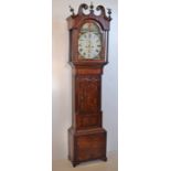 A 19th century oak longcase clock. With double ogee arched pediment with brass scroll ends and