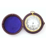 "Griffin & George Ltd" English made pocket barometer, gilt metal case, contained in a maroon leather