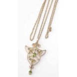 Edwardian 9ct gold seed pearl and peridot pendant on 9ct gold chain, gross weight 3.9g.