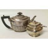 A Lidded silver sugar pot together with a tea pot. Approx weight 751.8g Unfortunately we are not