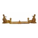 A 20th century brass fire curb. With frieze detail and two large putti warming hands around the