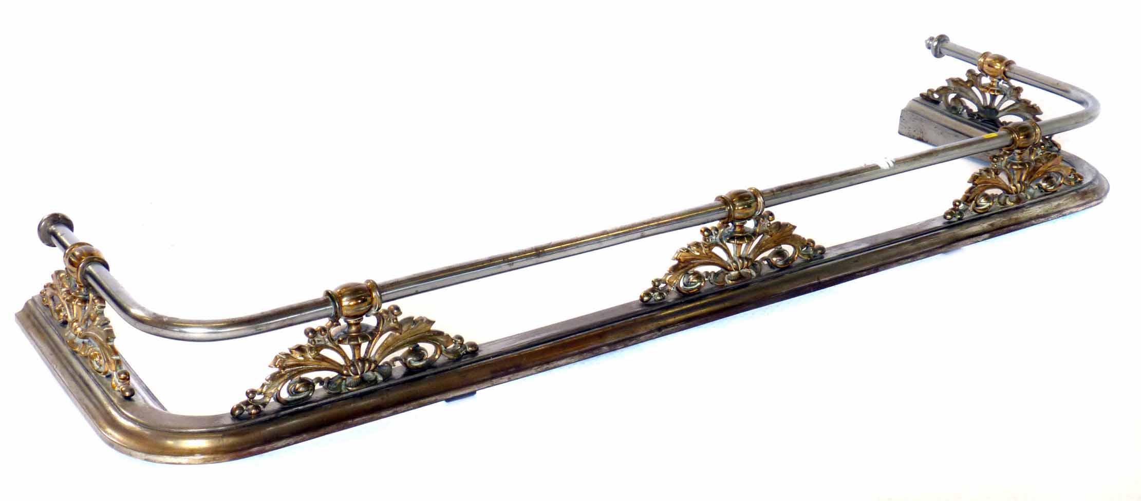 A Victorian brass and steel fire curb with foliate detail. 124 x 32 cm