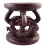 African Title Stool, Igbo people Nigeria, carved with arched legs around a central column, the