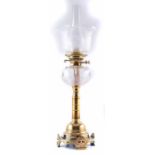 A 19th century brass oil lamp with frosted, acid-etched shade and ridged cut glass oil well. 70 x 22