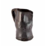 A 17th century black-jack, hand-stitched leather jug. Inscribed with 'Mary. S, 1640'. 12.3 cm