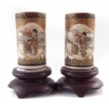 Pair of small Japanese Satsuma vases, of tubular form painted with figures in interiors and