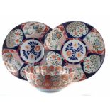 Japanese bowl, with lobed rim finely painted in an imari palette, together with two imari chargers,