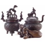 Two Japanese bronze koros, with pierced covers and Dog of fo finials, also a bronze figure