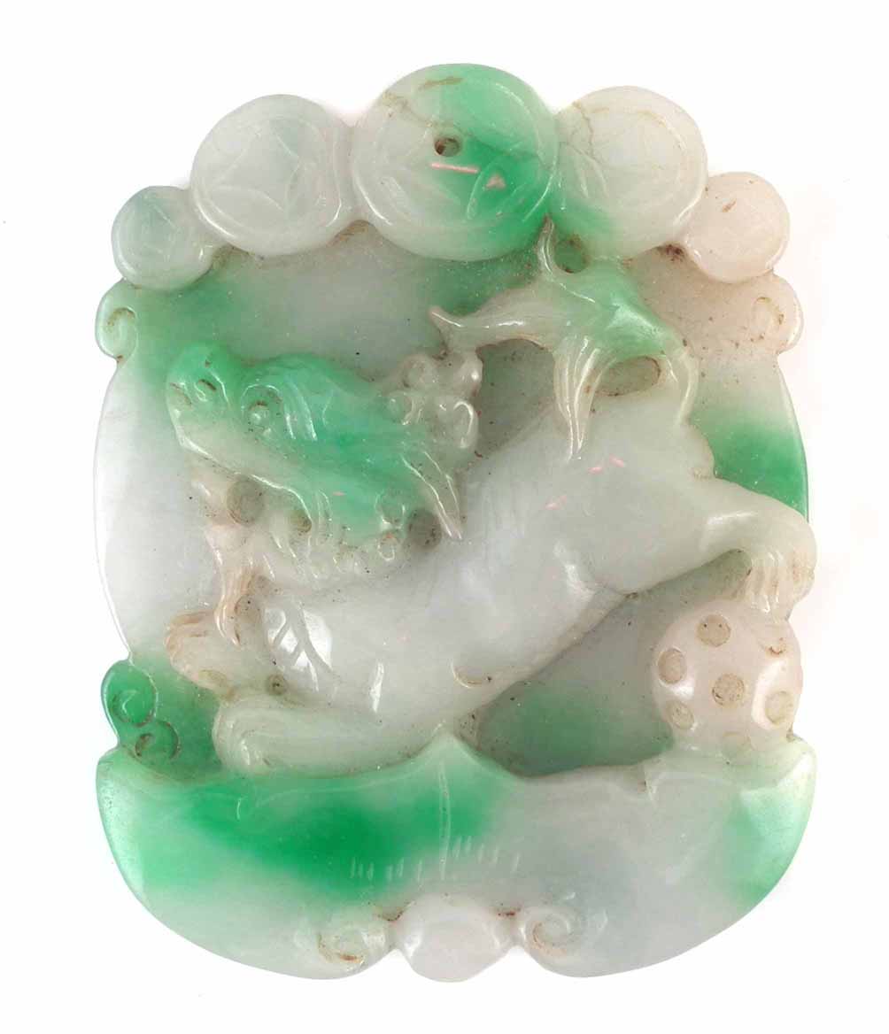 Chinese Jade plaque or pendant, carved with a dog of fo, 7.7cm high. Condition report: cracks/