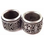 Two Chinese silver archer’s rings, with pierced turning bands, impressed marks to insides, (2) 3cm