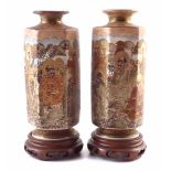 Pair of Japanese Satsuma vases, painted with immortals within landscapes, indistinct signatures to