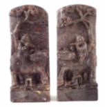 Pair of Chinese soap stone tablets or bookends, carved with boys playing flutes riding buffalos,