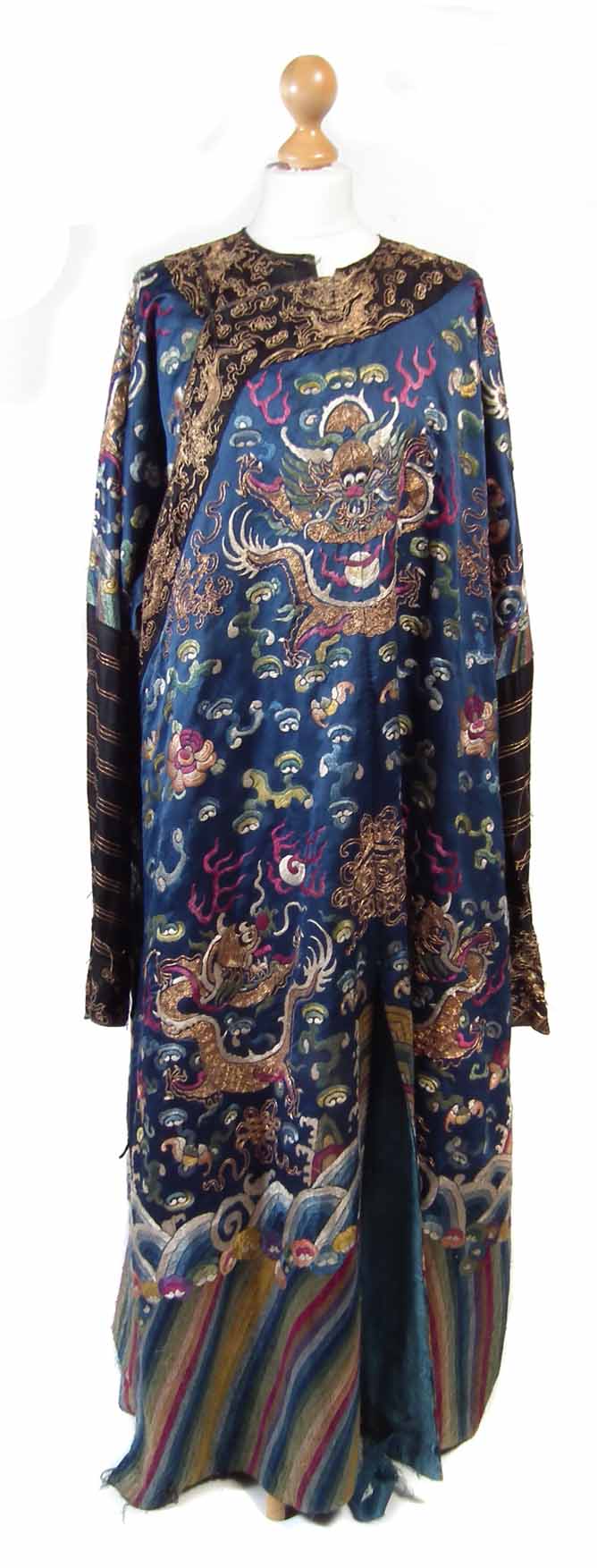 Chinese silk evening coat depicting dragons and mythical figures, 134cm overall length. Condition