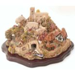 Lilliput lane village on wooden base We cannot do condition reports for this sale.