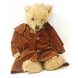 Early 20th centruy teddy bear with jointed limbs and glass eyes 58cm long We cannot do condition