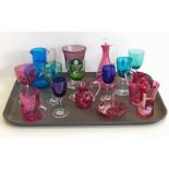 A collection of Victorian coloured glassware some enamelled in Mary Gregory style, also a Queen