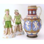 Victorian majolica jug decorated with Cherubs, also a pair of slip cast figures.