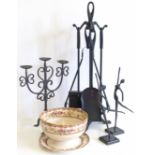 Cast metal companion set, candle stand, two figures and pottery bowl and plate.