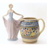 19th century barrel shaped jug, the central strip decorated with floral image and Lladro figure,