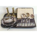 Three 19th century punch ladles, a pair of brass candle sticks, two plated salvers, a cased set of