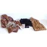 A quantity of mixed fur coats and wraps and gloves.