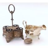 A Victorian silver bottle stand, Sheffield 1875, also a sauce boat and Maltese filigree locket