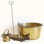 A large brass kettle with swing handle and miniature coal bucket, brass door stop and crocodile