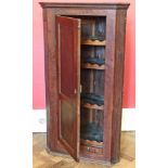 George III oak single door corner cupboard, interior with three fixed shelves with wavy edge.