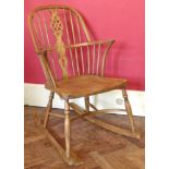 Late 20th century Windsor wheel-back arm chair on rockers, turned legs united by crinoline