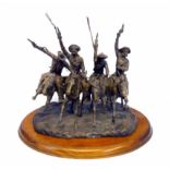 A miniature bronze after Frederic Remington, 'Coming Through The Rye'. On wooden base 23 x 20 cm.