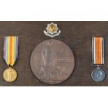 A pair of World War One medals awarded to 4987 PTE. S. CORNES with memorial plaque.