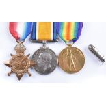 A World War One trio of medals awarded to 14559 PTE. T. BROWN CHES. R. and a pendant of a bullet.