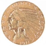 A five dollar gold eagle coin, 8.3 grams, dated 1911.